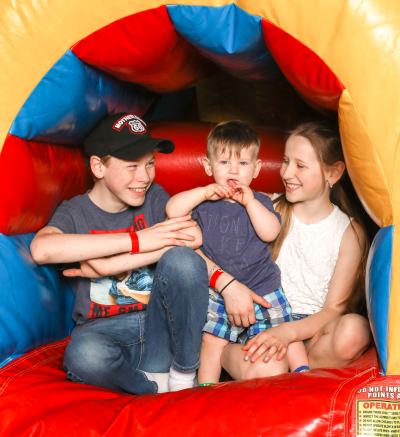 kid on inflatable slide