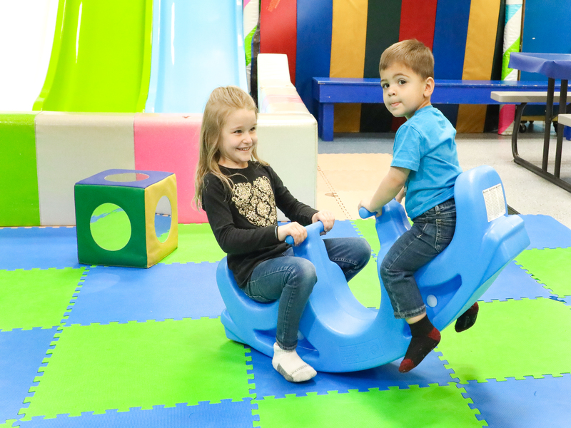 kid on inflatable slide