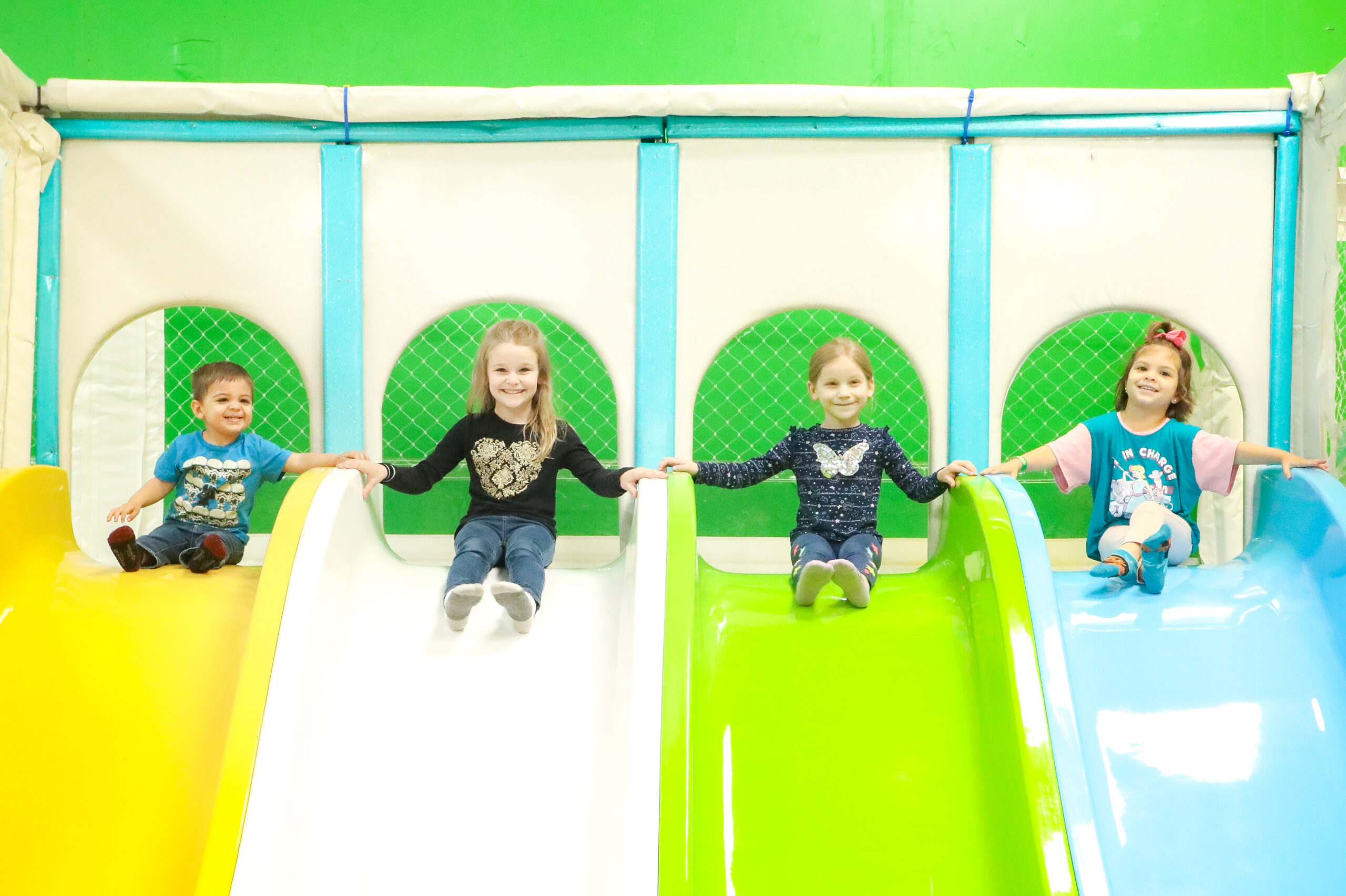 kid on inflatable slide