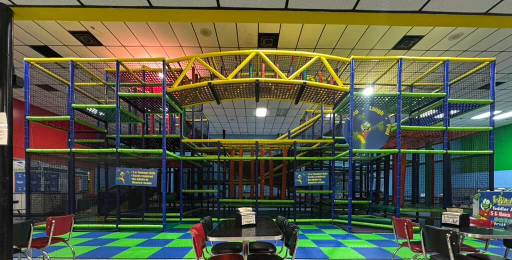 Four children in an inflatable castle. 