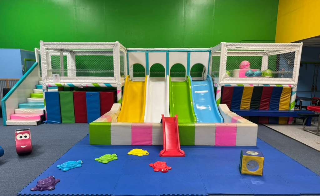 Four children in an inflatable castle. Four children in an inflatable castle.