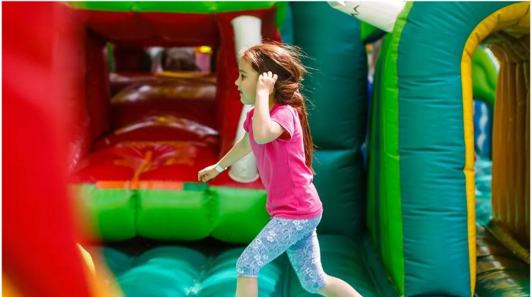 Four children in an inflatable castle. Four children in an inflatable castle.